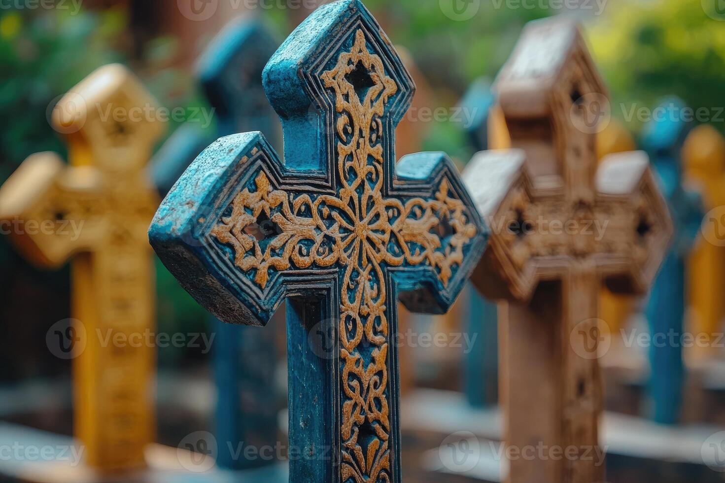 Row of colorful carved wooden crosses symbolizing faith and spirituality photo