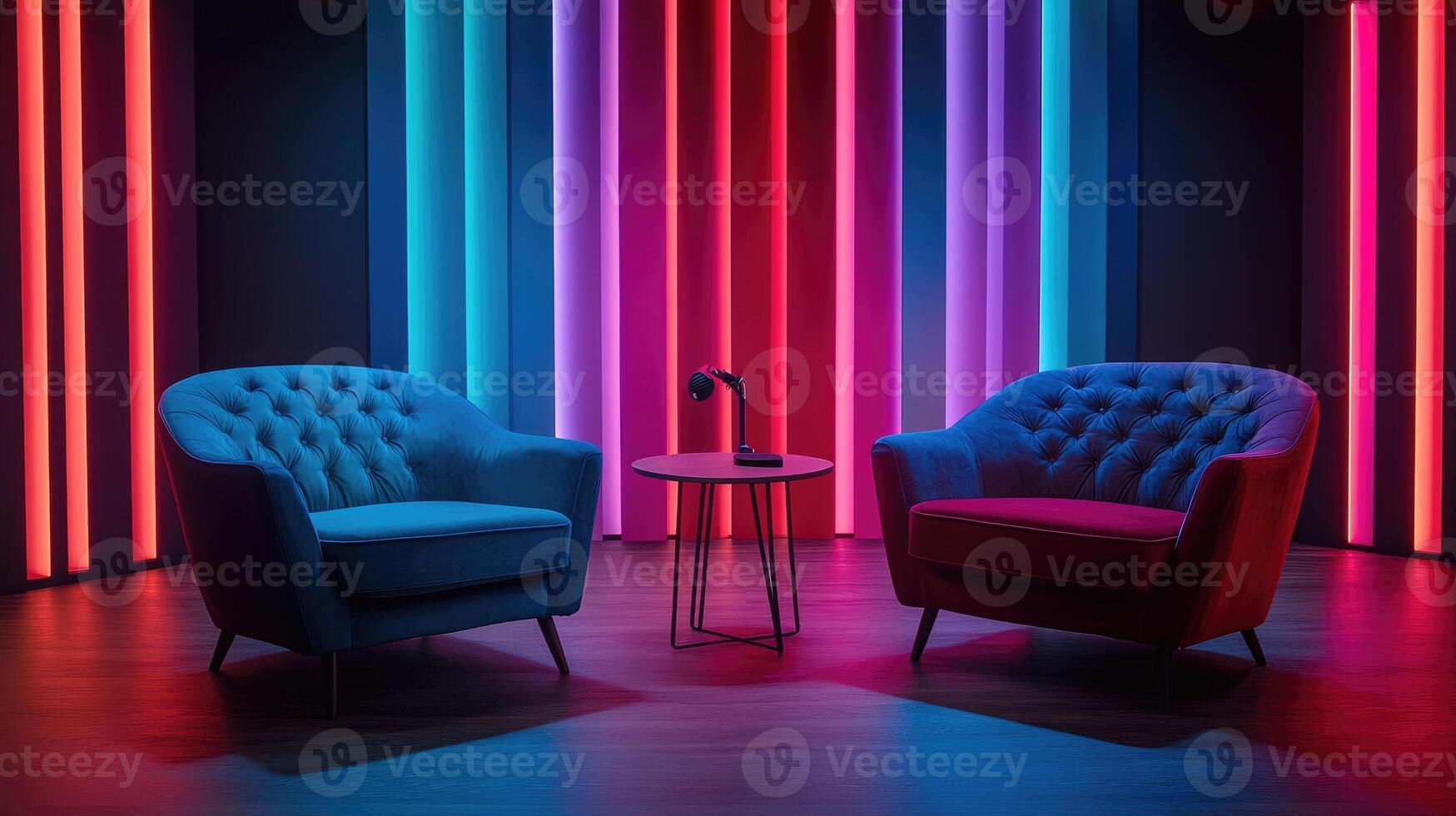 Two empty armchairs facing each other in a recording studio with colorful neon lights photo