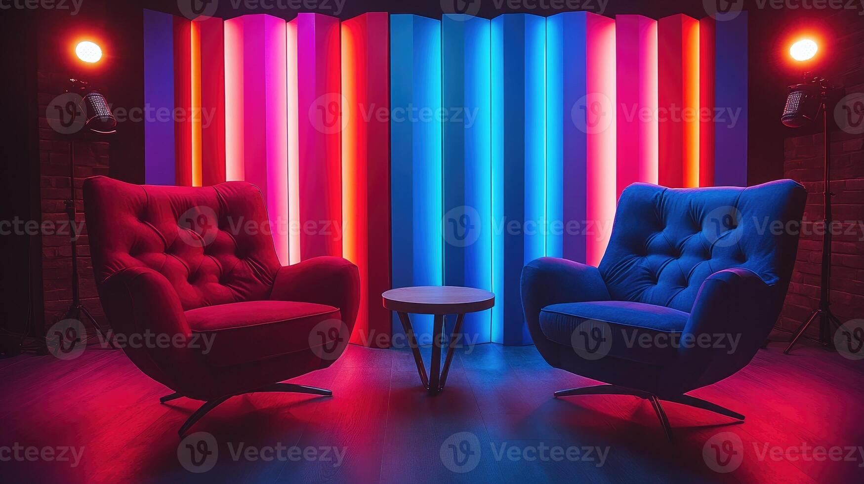 Two empty armchairs facing each other in a recording studio with colorful neon lights photo