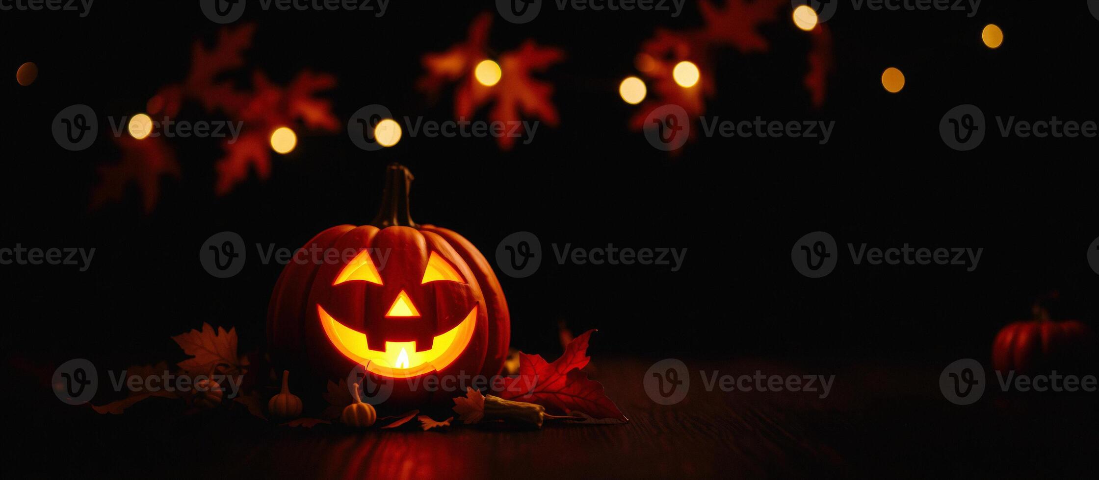 Jack-o'-lantern with flickering candlelight photo