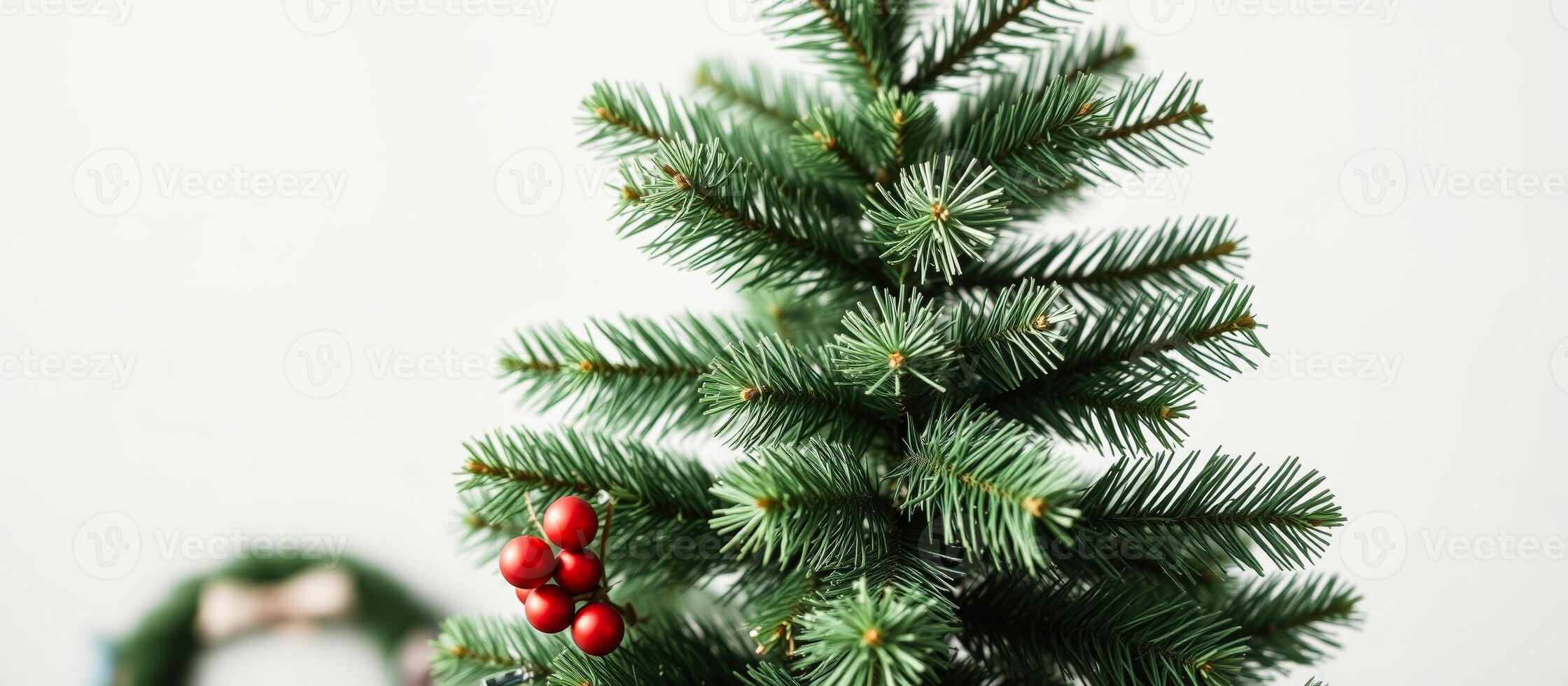 Close Up of a Christmas Tree Branch with Red Ornaments photo
