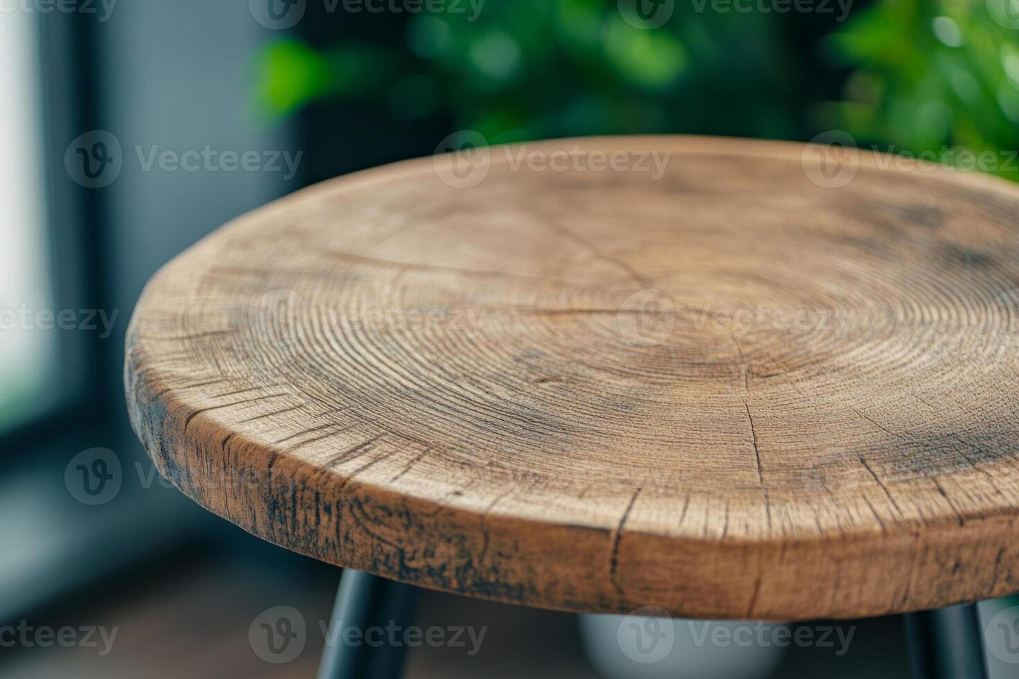 Close-up of a dark wooden tabletop showcasing a rustic matte finish in a modern interior setting photo