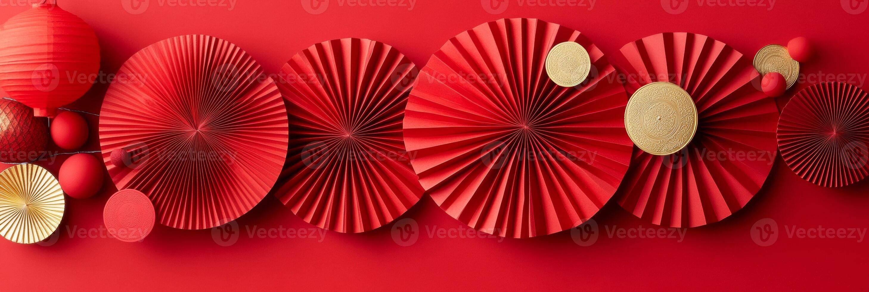Chinese New Year 2025 decorations featuring red paper cutouts and golden lanterns on a festive red background photo