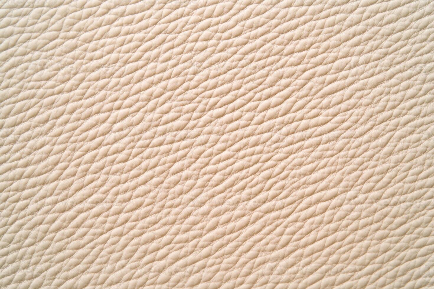 Elegant and warm leather surface with subtle textures in a light beige tone suitable for various design projects photo