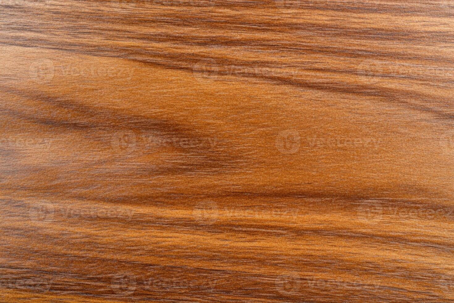 Close-up of modern textured wooden kitchen cabinets in warm brown tones with subtle grain details photo