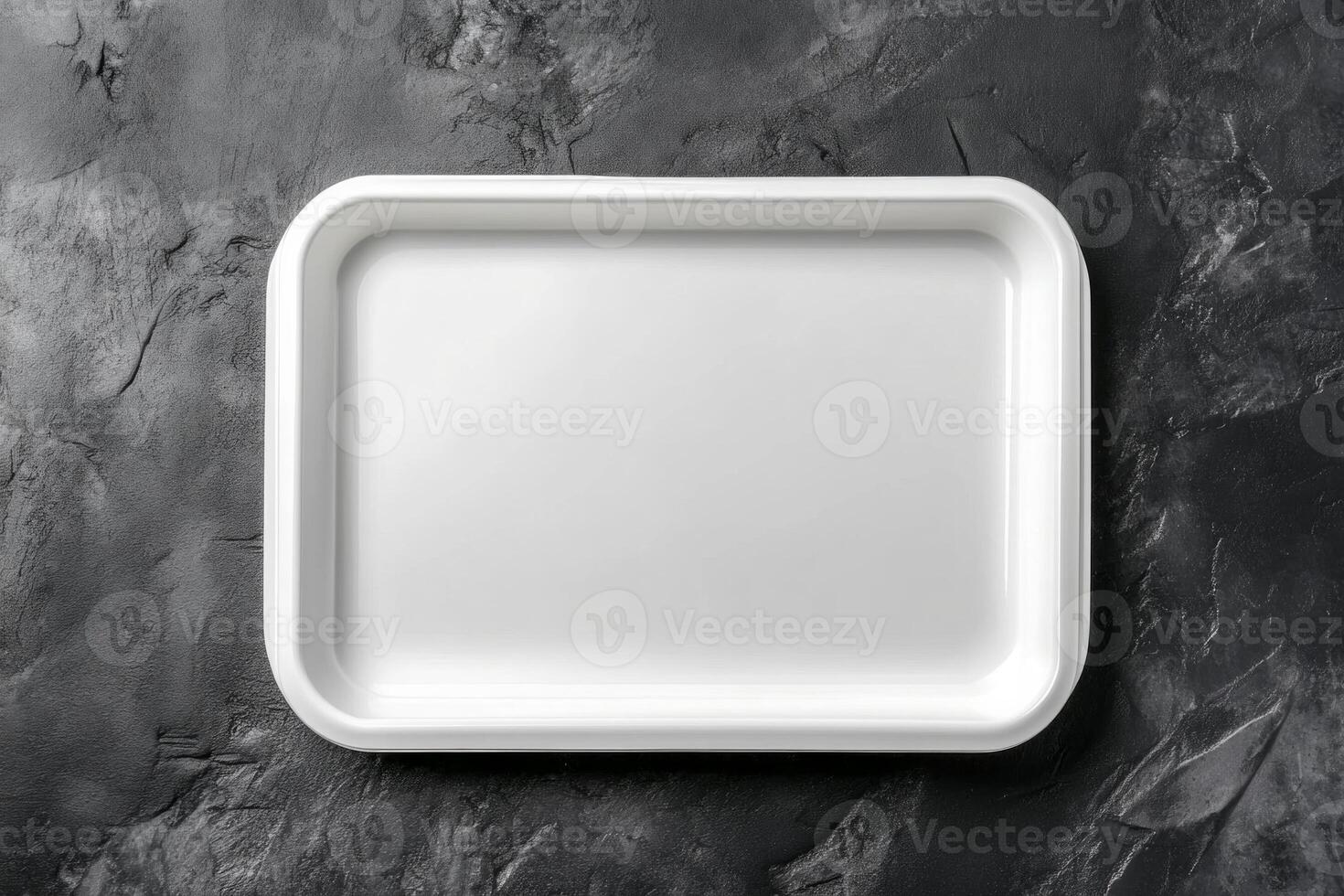 Minimalist paper tray mockup in a white plastic container on dark surface designed for creative presentations photo