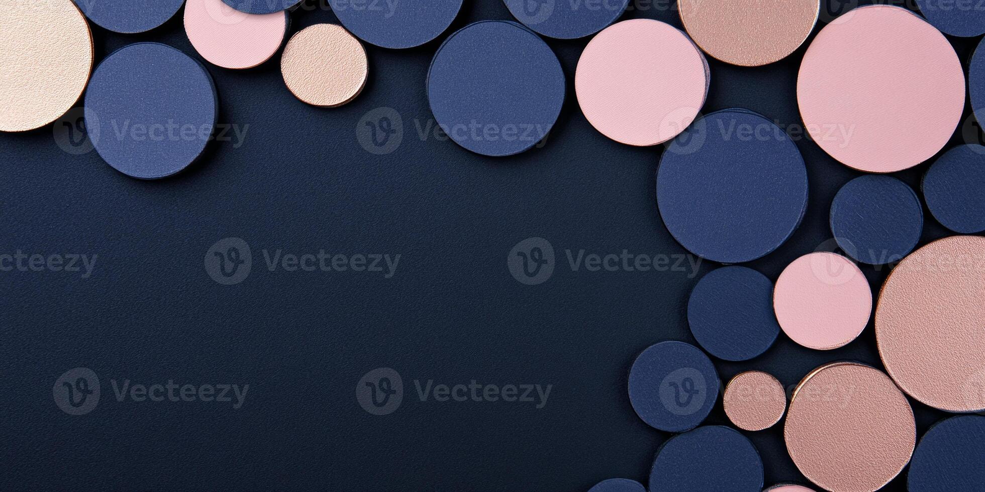 Minimalist abstract composition with pastel pink circles on a dark background showcasing metallic textures photo