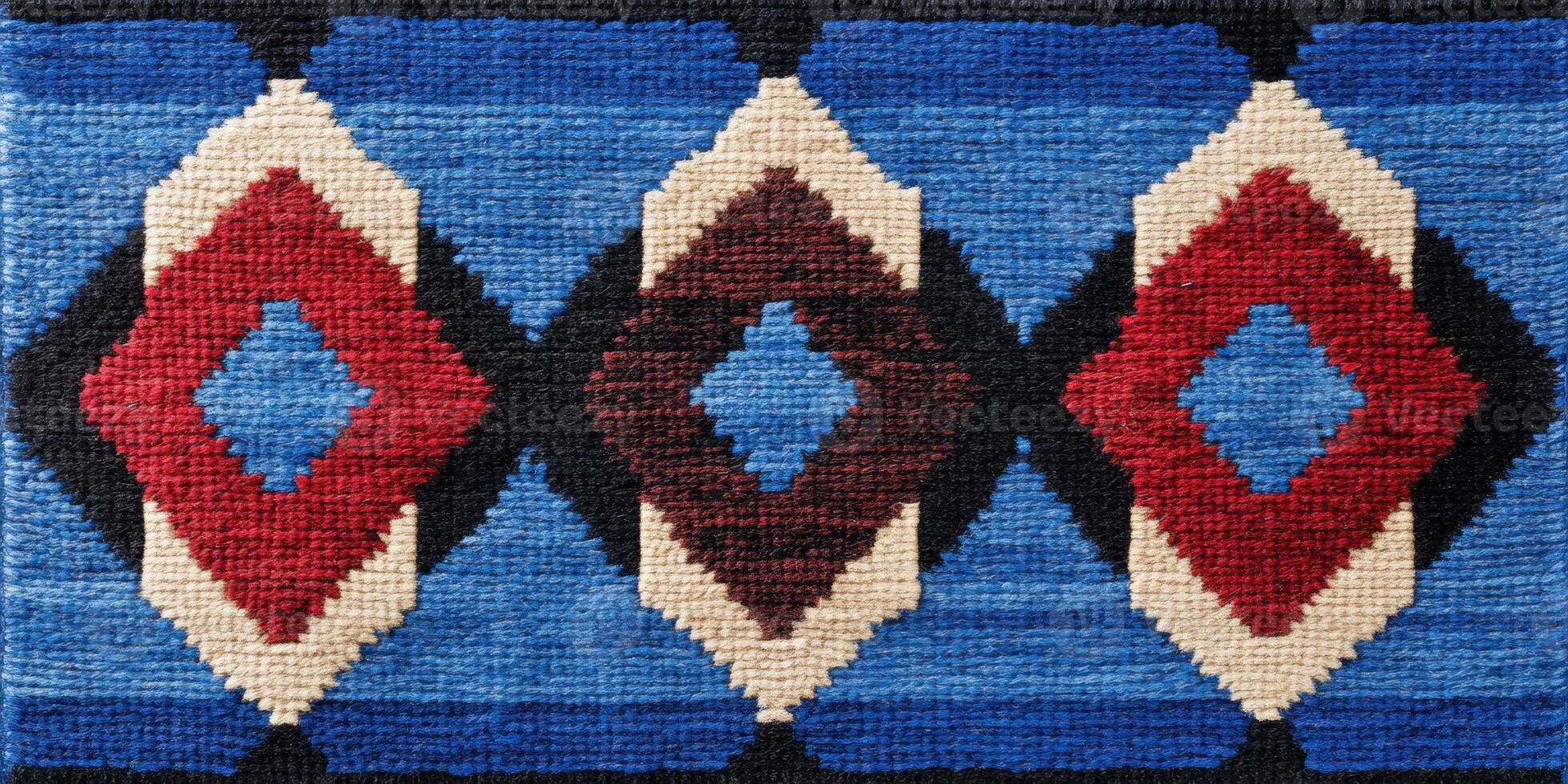 Southwestern rug featuring intricate tribal designs and geometric patterns in blue, red, and black on textured wool photo