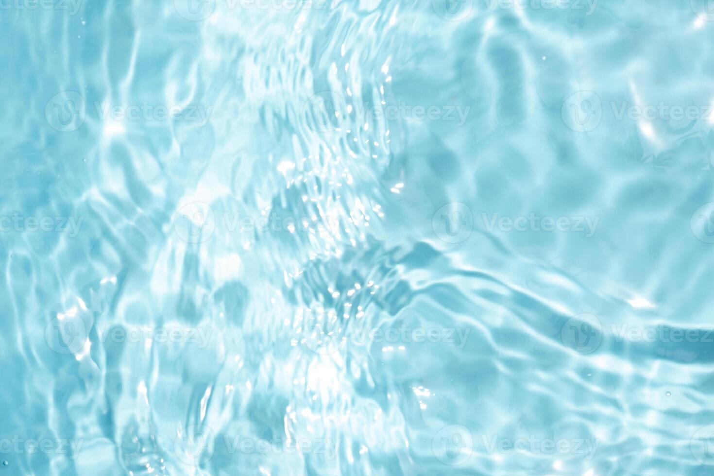 Close up Transparent blue clear water surface texture with ripples photo