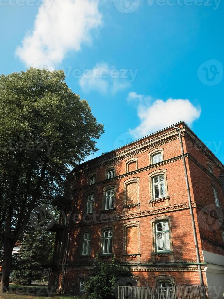 Old red brick house in vintage style. photo