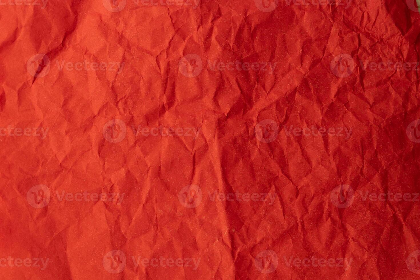 Background texture of crumpled red paper photo