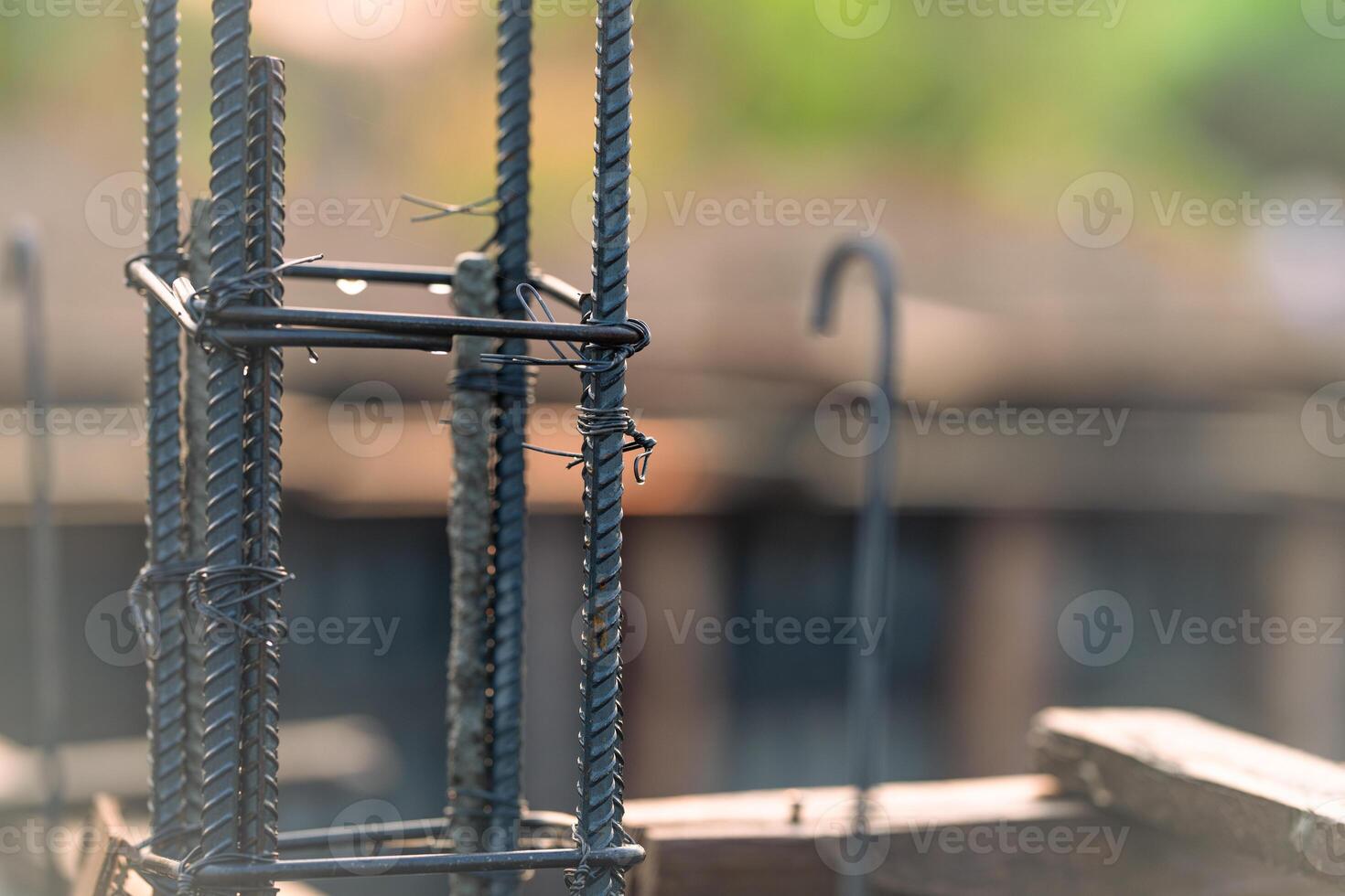 Concrete footings and reinforcing steel rods at a construction site. Groundwork for new building foundation. Reinforcement steelwork providing strength and stability for long term structural integrity photo