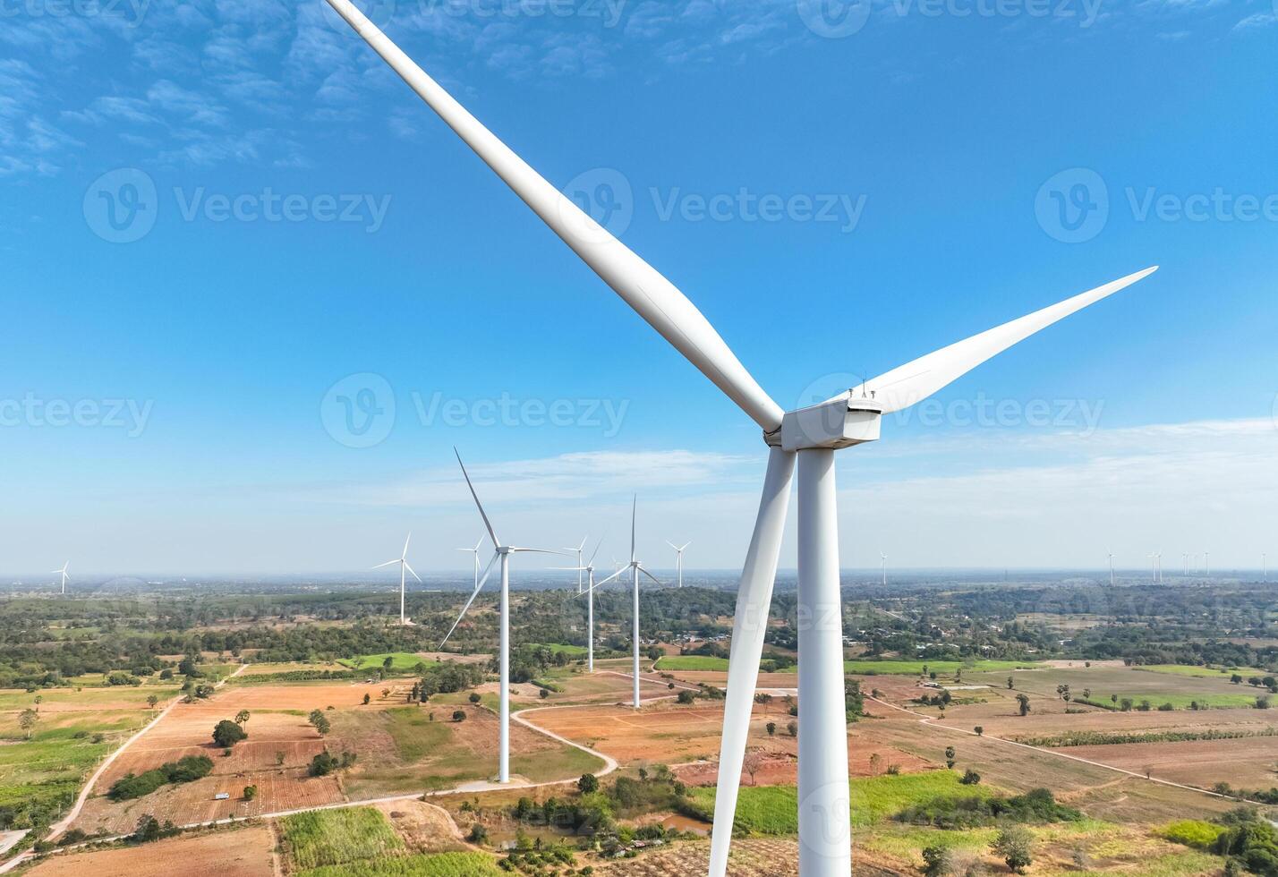 Wind energy and sustainable power generation with wind turbines, Eco-friendly solutions for renewable resources. Wind power farm and sustainable development of renewable energy, green technology. photo