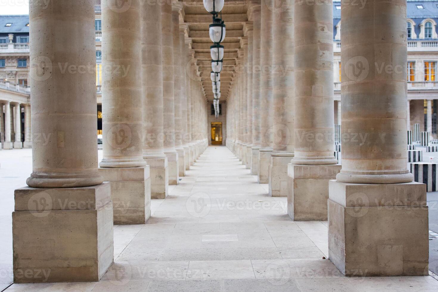 Symmetrical Stone Columns in Palais Royal Creating a Sense of Depth and Grandeur photo