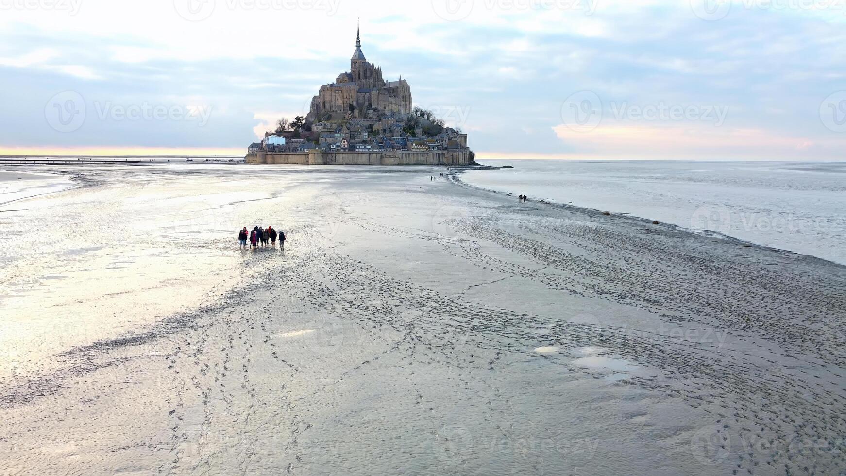 Aerial View of Group Walking to Mont Saint-Michel Mont Saint-Michel, Normandy photo
