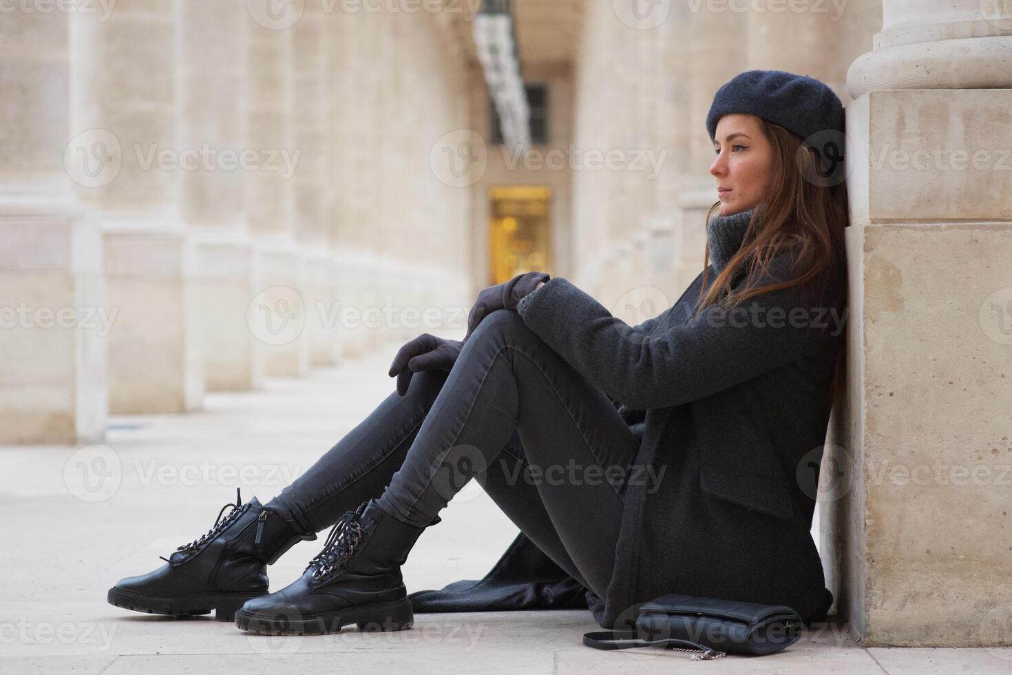 Stylish Beautiful Woman in Beret and Boots Relaxing in Parisian Courtyard France photo