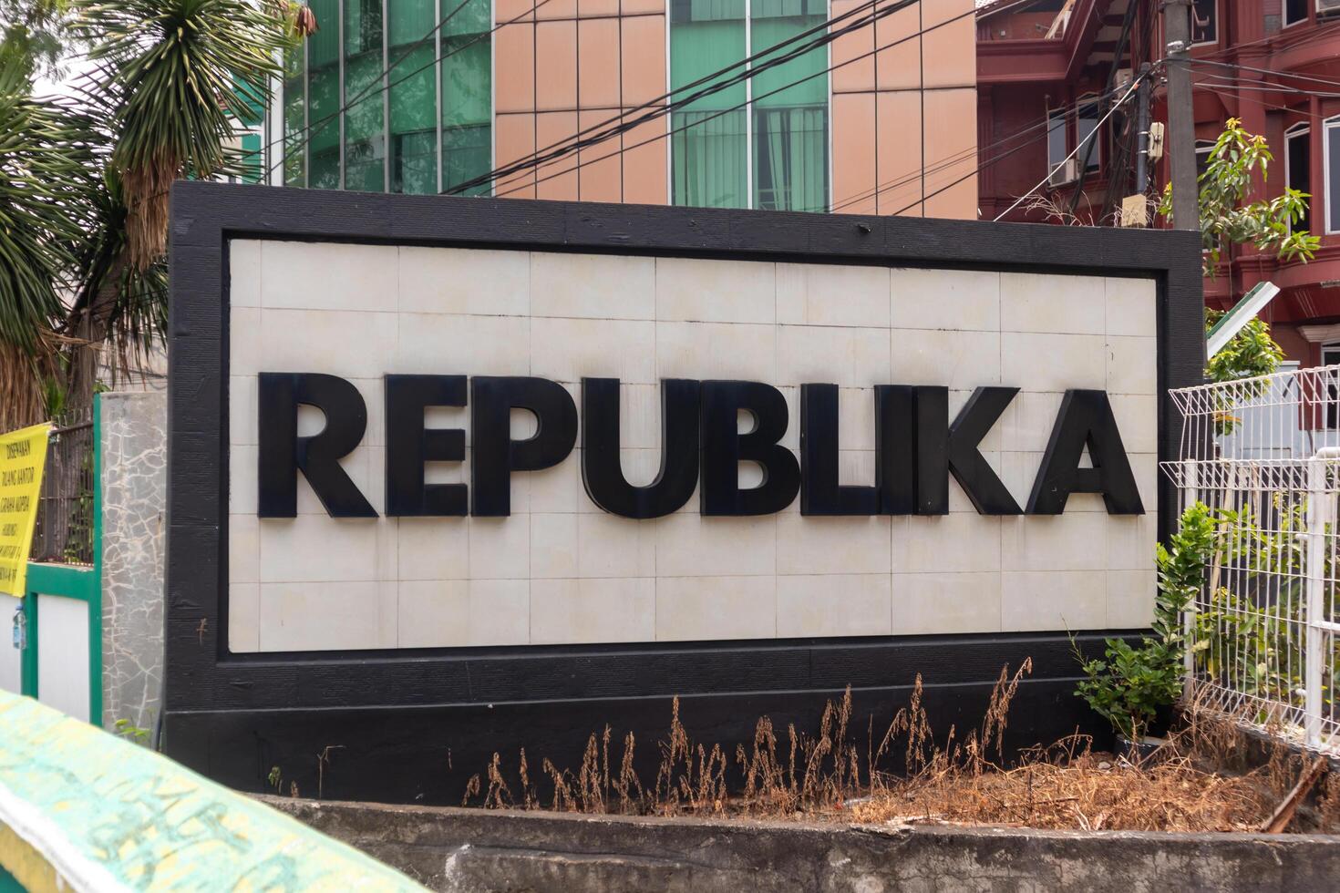 Jakarta, Indonesia, 2024 - Republika newspaper company signboard in front of office building. An Indonesian national daily newspaper. photo