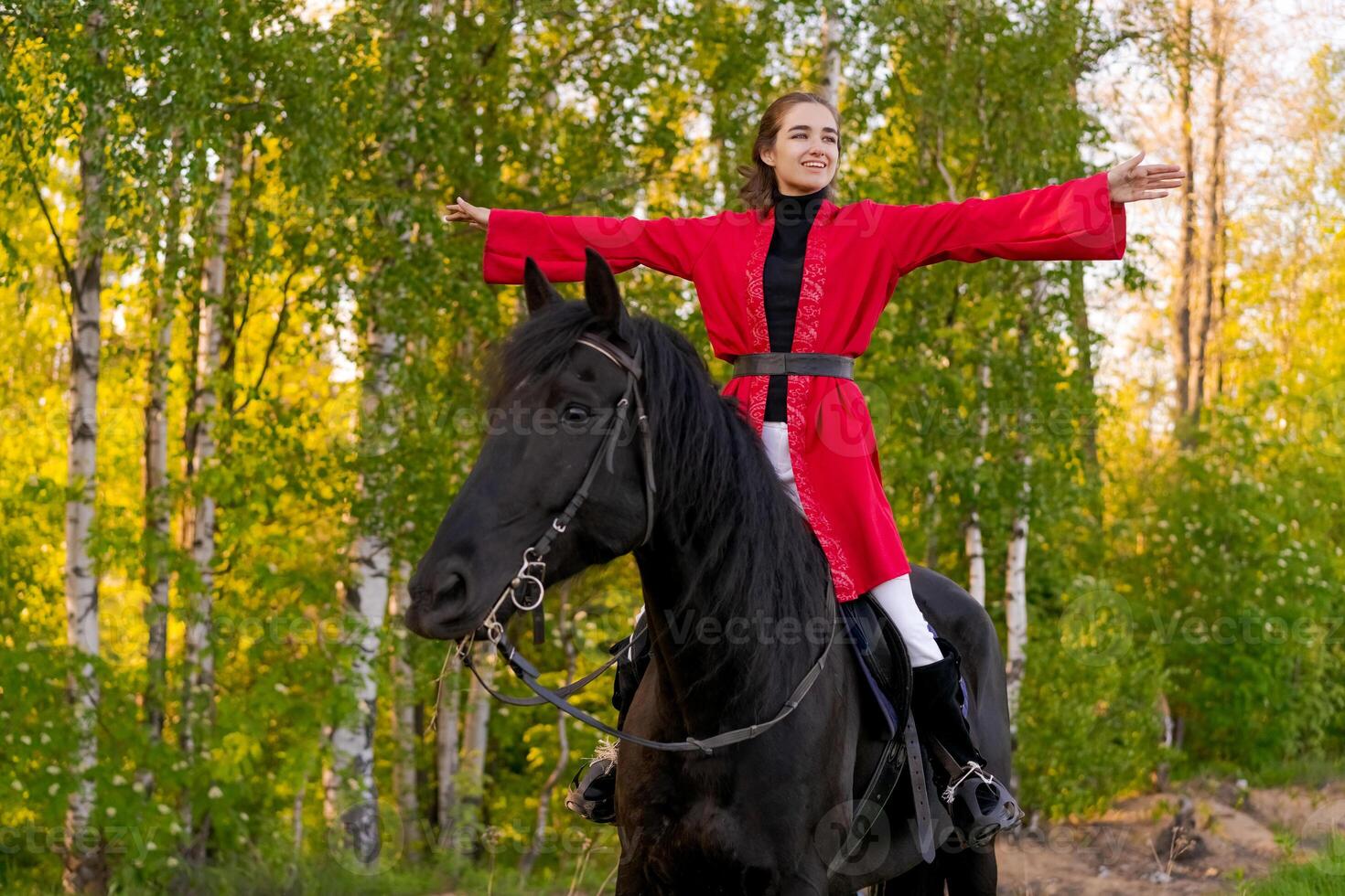 woman-is-riding-a-black-horse-in-a-forest-52448069-stock-photo-at-vecteezy