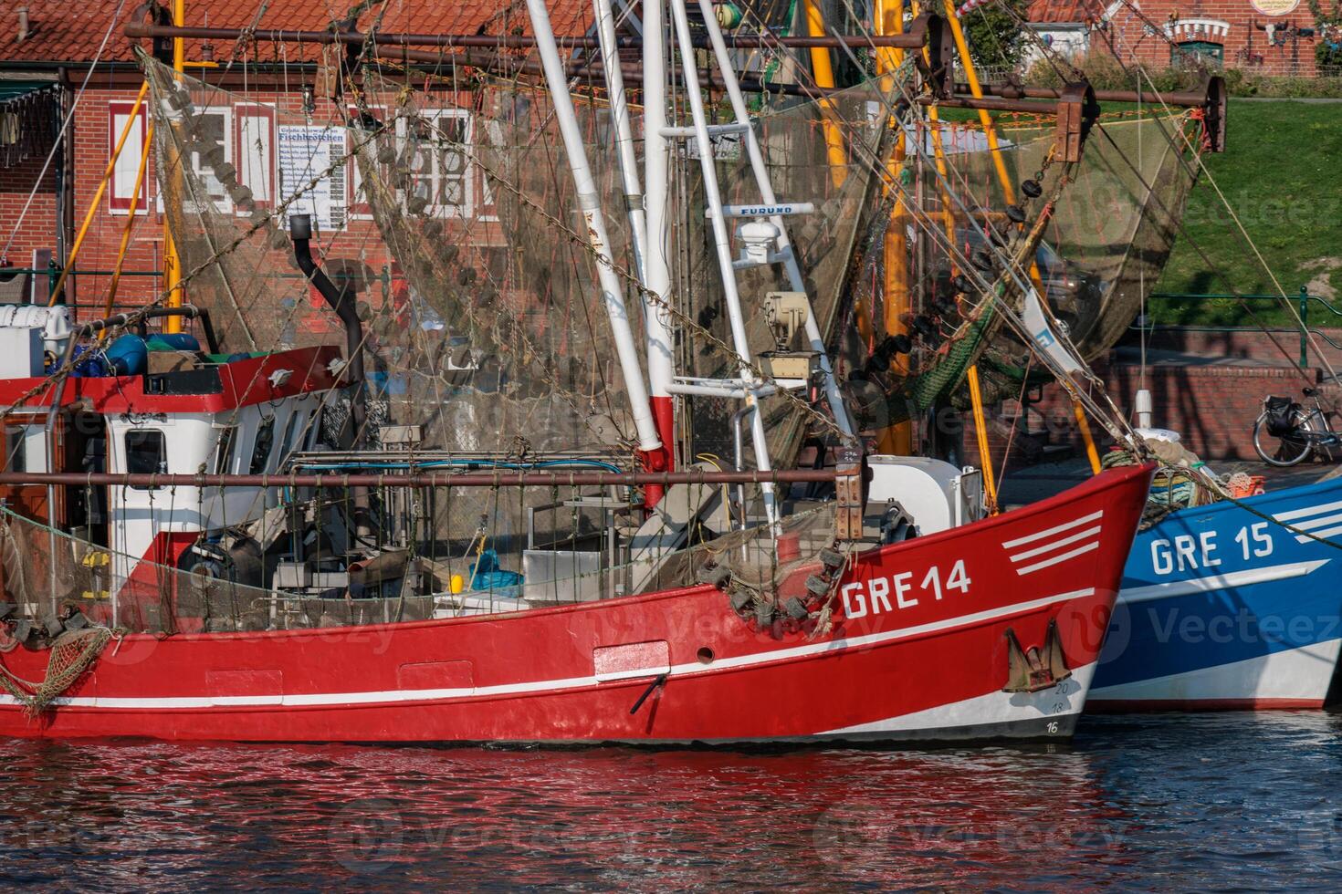 The boat is red and white photo