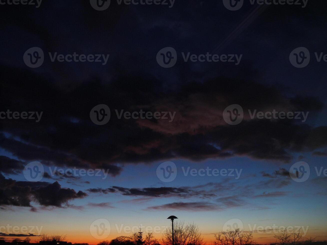 A sunset with clouds and a sky photo