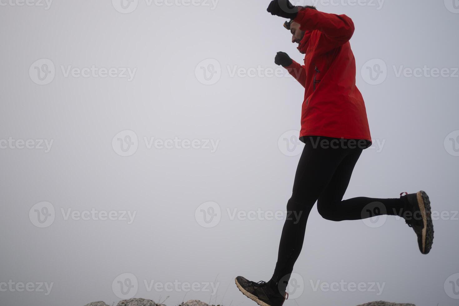 sky running or trail running woman exercising on a mountain top photo