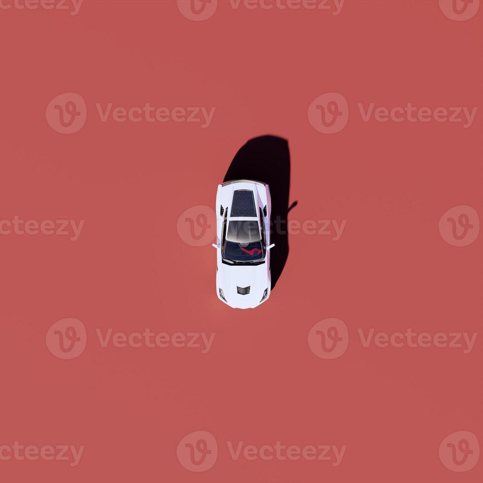 An overhead view of a white car on a red background photo