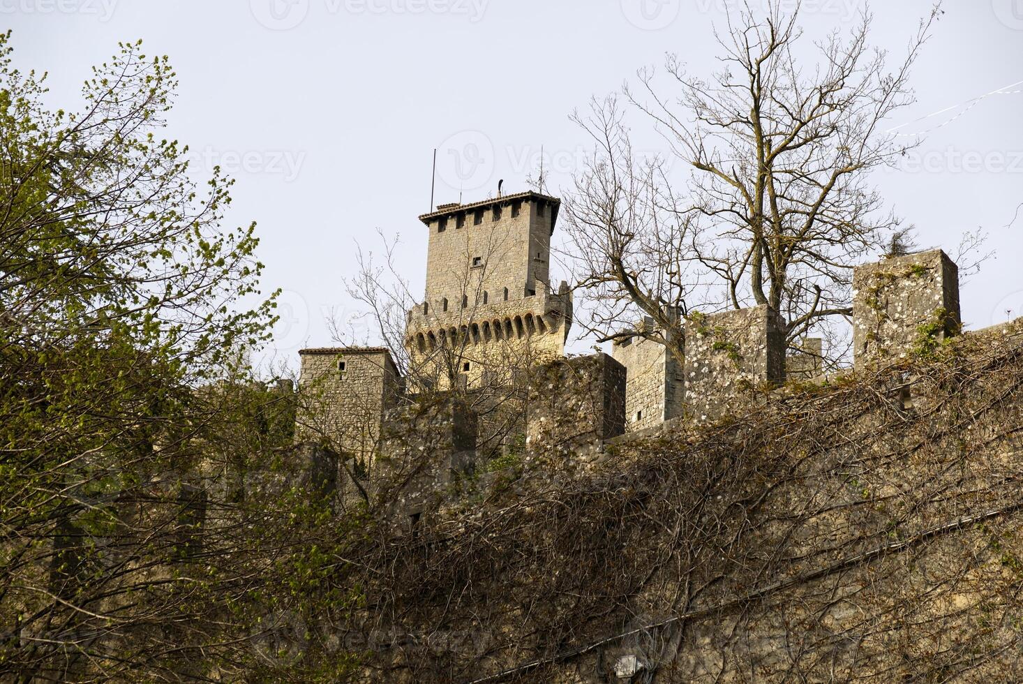 middleage town citywall stonewall and castle towers photo
