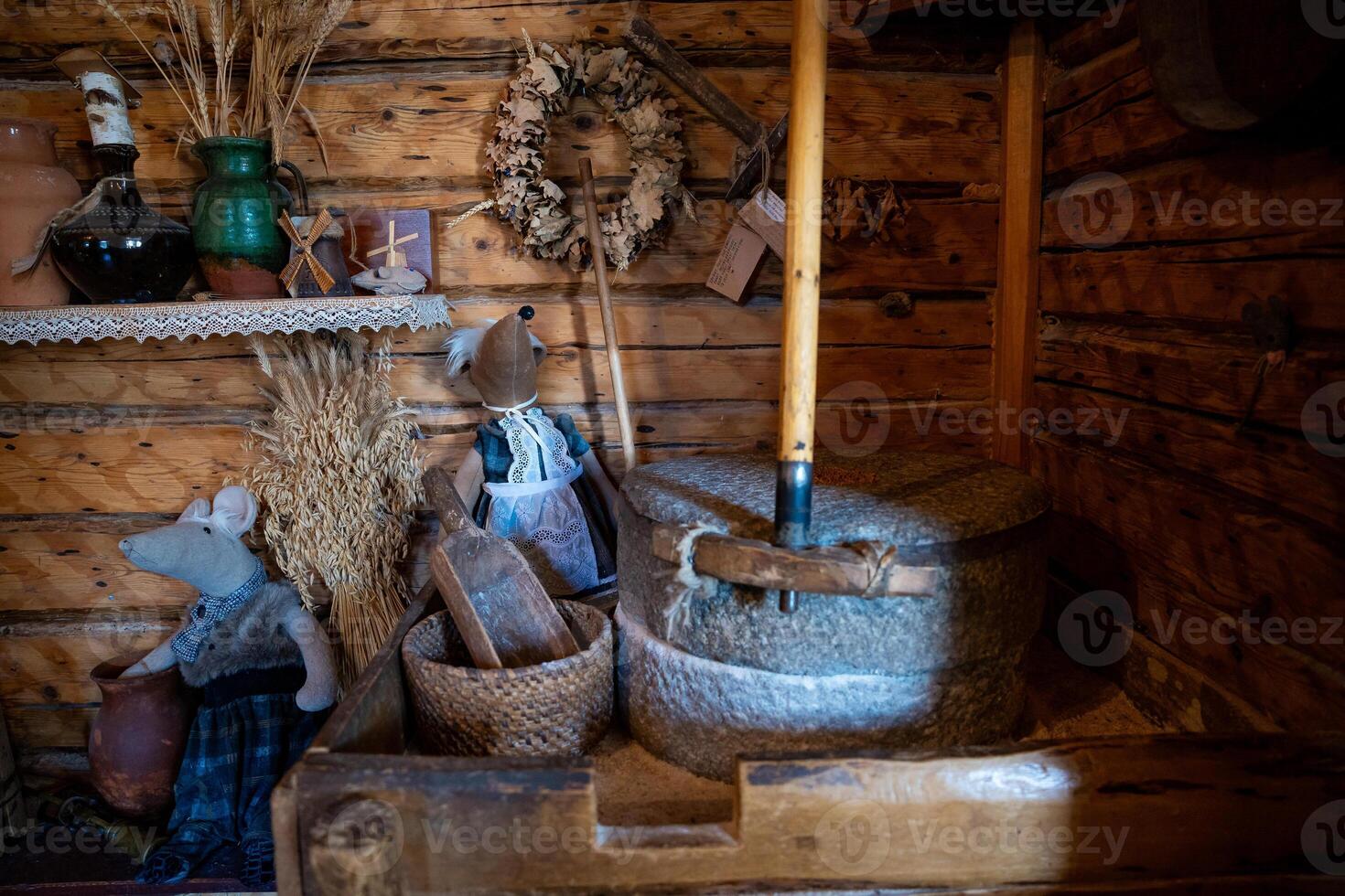 Rustic Cabin Interior with Vintage Items and Stone Mill Display photo