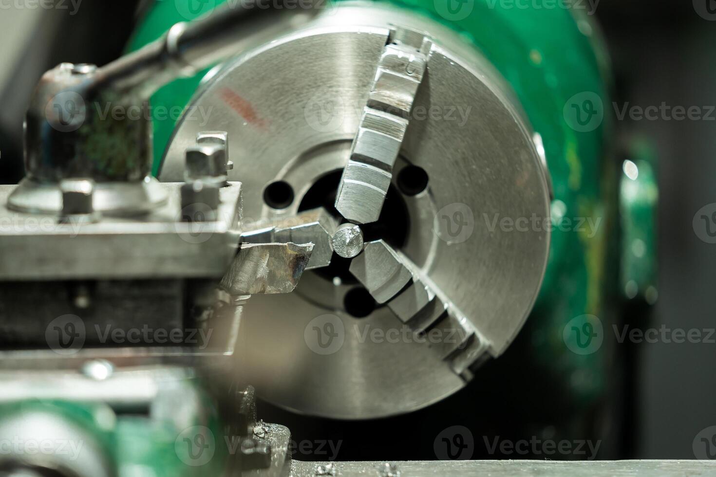 An old, well used lathe machine in a workshop, a vital tool for metalworking and precision engineering tasks. photo