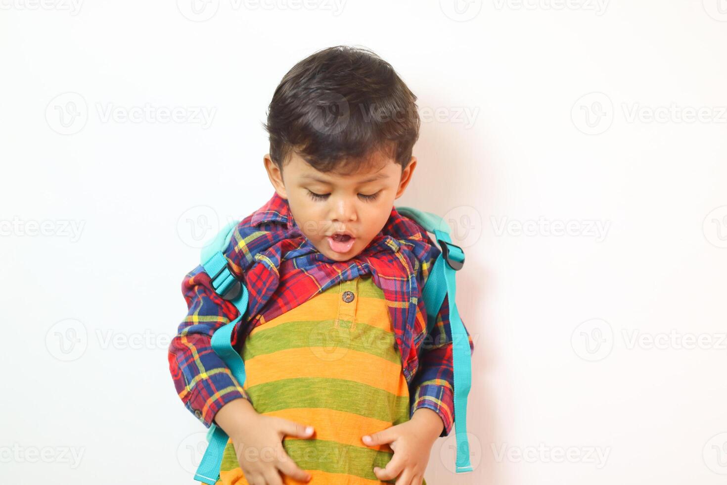 Asian toddler undressing in studio shot isolated on white background, Portrait of little preschool child, Back to school photo