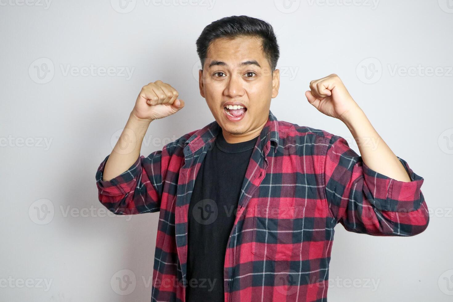 Full body young overjoyed excited happy asian man do winner gesture isolated on white background studio portrait. People lifestyle concept photo