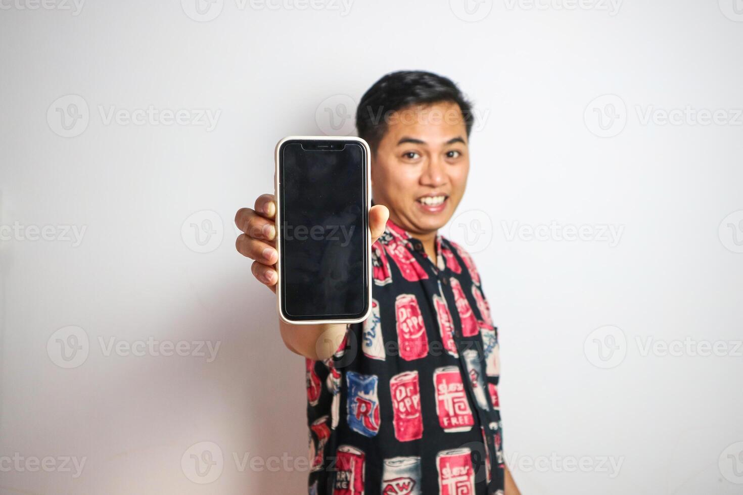 Traveler asian man show mobile phone and feels excited about booking at holiday isolated photo