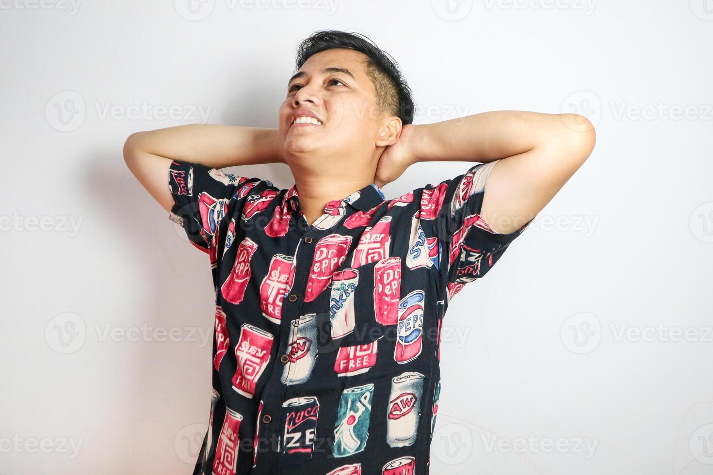 Asian man in glasses relaxing with hands behind head, Vacation concept photo