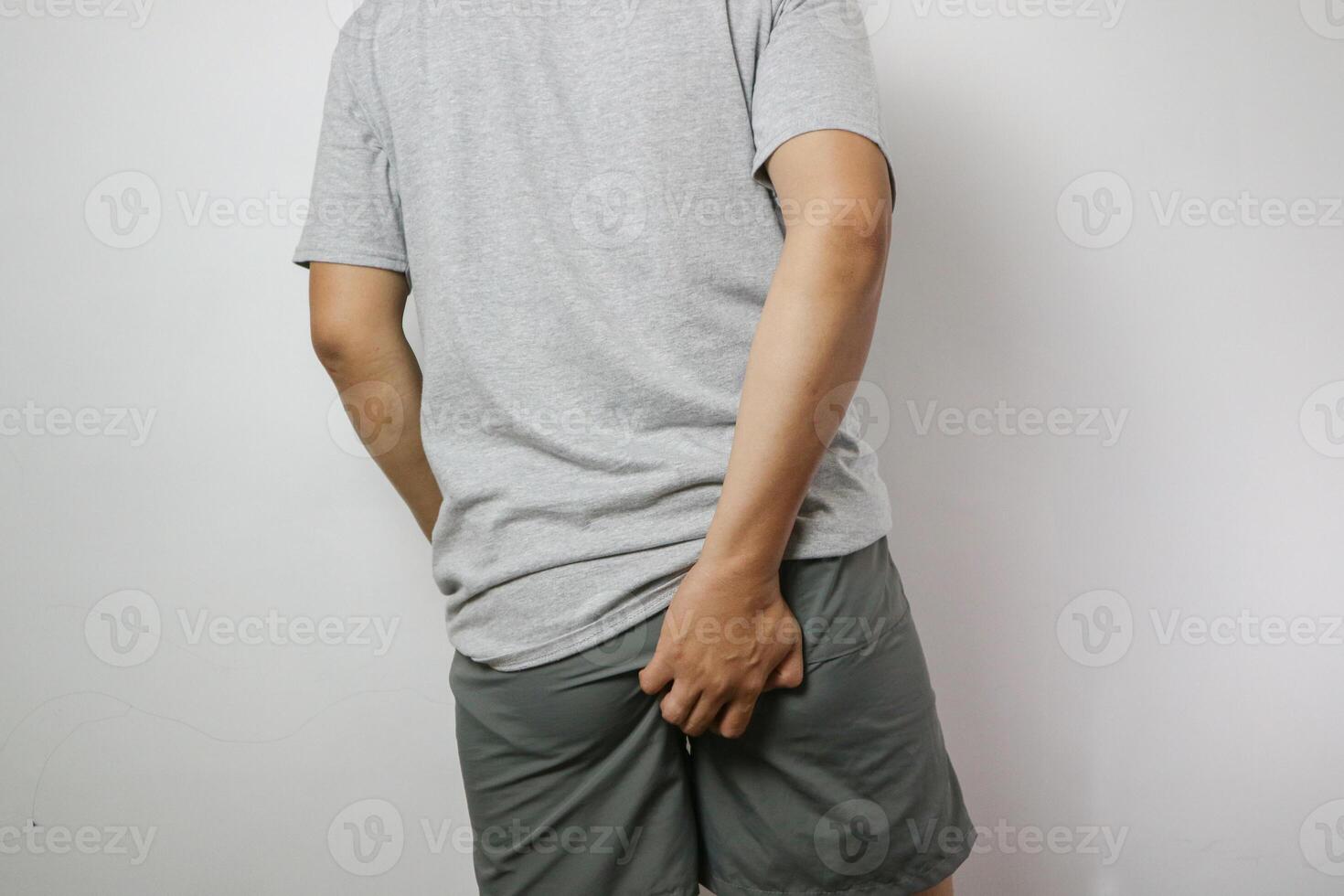 Asian man with diarrhea problem, Man with digestive problem touching his buttock, man with hemorrhoid problem. photo