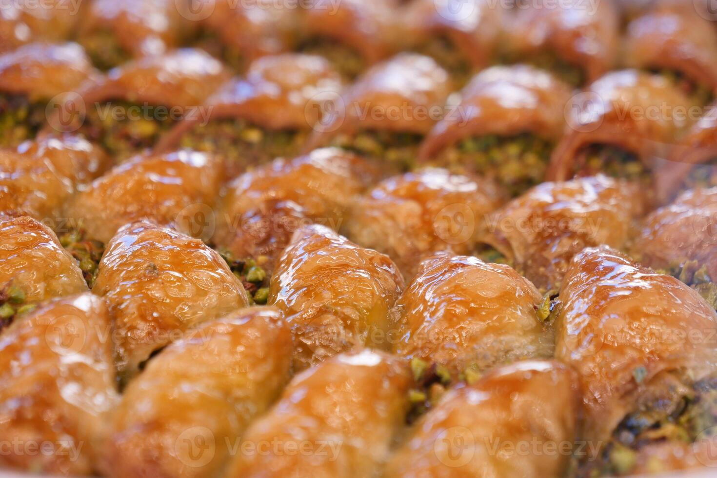 Enjoy the mouthwatering and delicious Baklava Slices that come with a delightful Pistachio Topping photo