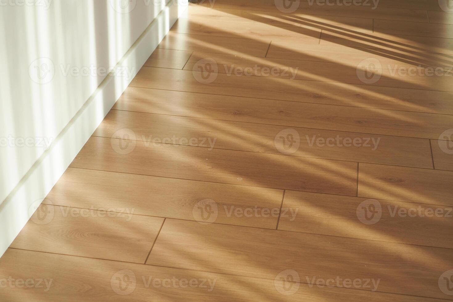 An Exquisite Beautiful Wooden Floor That Is Enhanced by Intriguing Shadows Cast from Natural Light photo