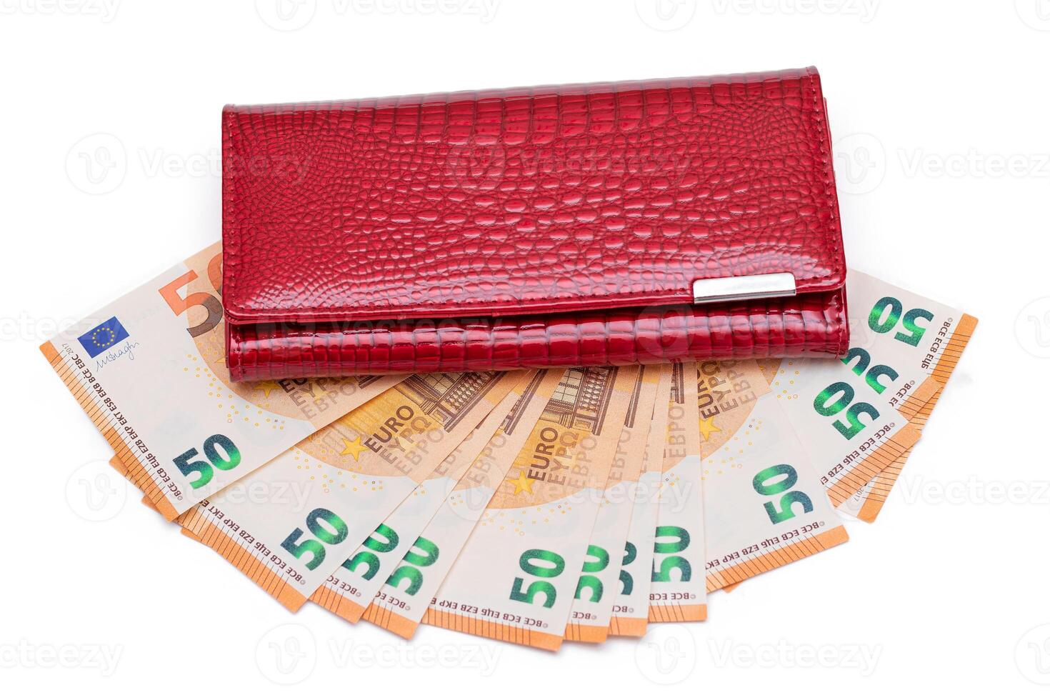 Red Leather Women Purse with Fifty Euro Banknotes - Isolated on White Background. A Wallet Full of 50 Euro Paper Money Symbolizing Wealth, Success and Social Status - Isolation photo
