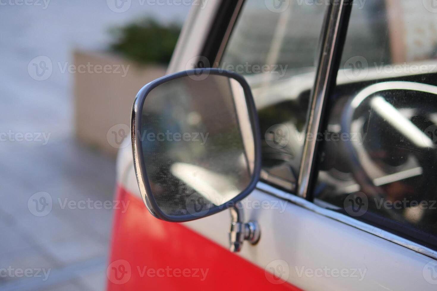 An Impressive CloseUp View of a Vintage Vehicles Side Mirror and Its Intricate Details photo