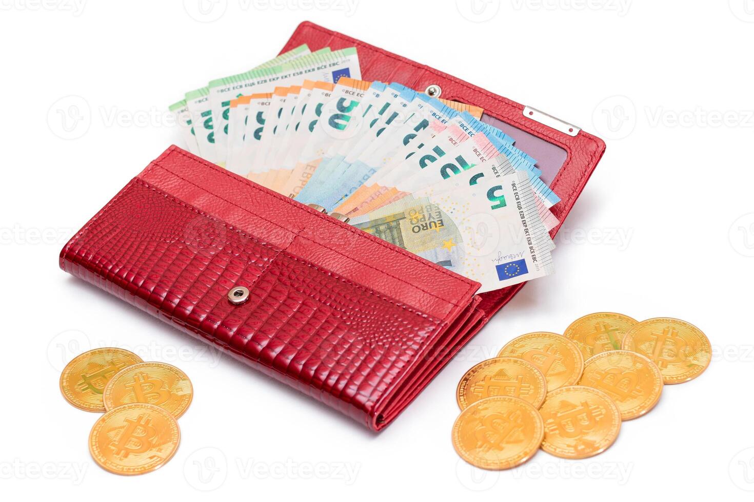 Red Leather Women Purse with Different Euro Banknotes and Bitcoin Coins - Isolated on White Background. A Wallet Full of European Union Paper Money Symbolizing Wealth and Success - Isolation photo