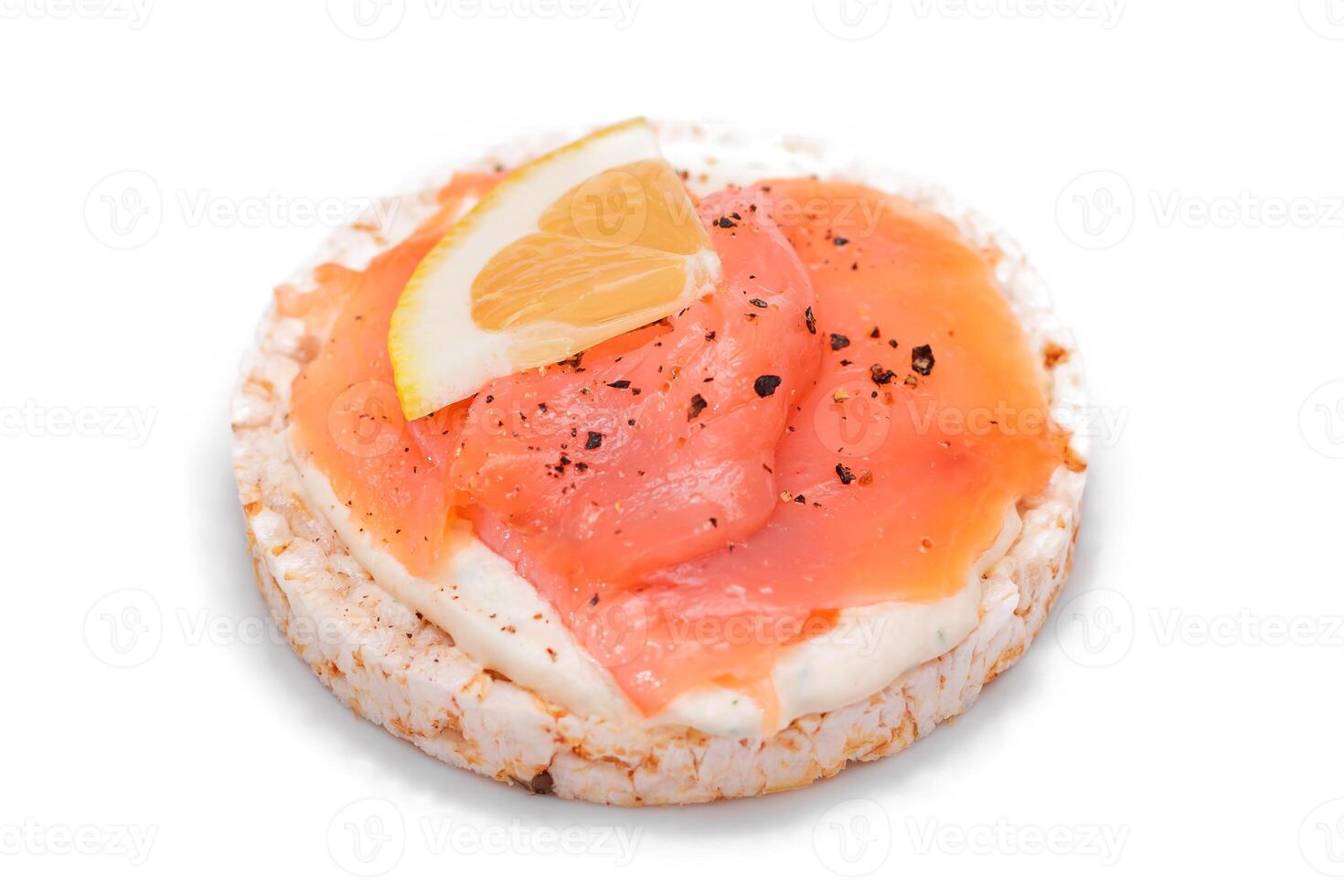 Rice Cake Sandwich with Fresh Salmon and Lemon - Isolated on White Background. Diet Food. Quick and Healthy Sandwiches. Crispbread with Fresh Fillings. Healthy Dietary Snack photo