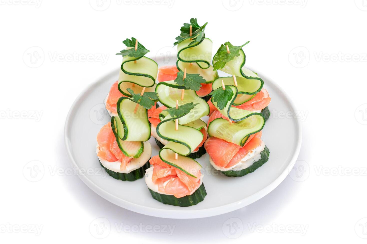 Canapes without Bread with Fresh Salmon, Cucumber and Cream Cheese - Isolated on White Background. Easy Breakfast. Diet Food. Quick and Healthy Sandwiches. Healthy Snacks with Tasty Fillings photo