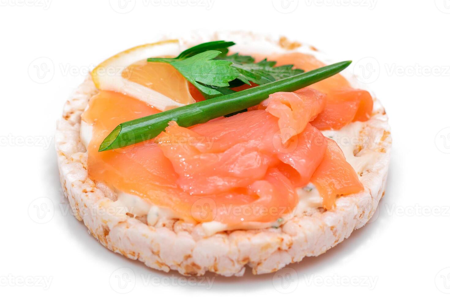 Rice Cake Sandwich with Fresh Salmon, Lemon and Greens - Isolated on White Background. Diet Food. Quick and Healthy Sandwiches. Crispbread with Fresh Fillings. Healthy Dietary Snack photo