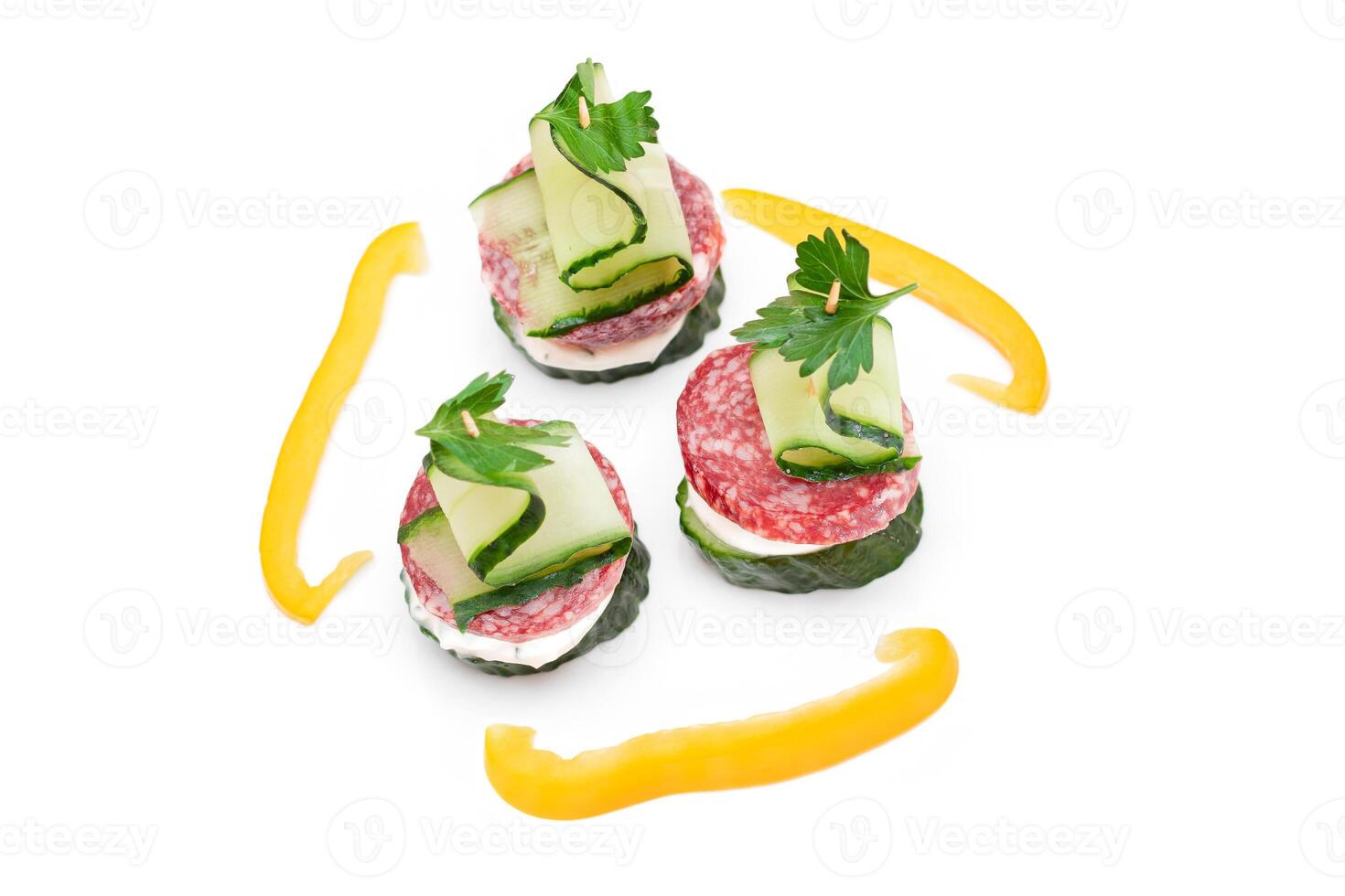 Canapes without Bread with Salami, Cucumber, Greens and Cream Cheese - Isolated on White Background. Easy Breakfast. Diet Food. Quick and Healthy Sandwiches. Healthy Snacks with Tasty Fillings photo