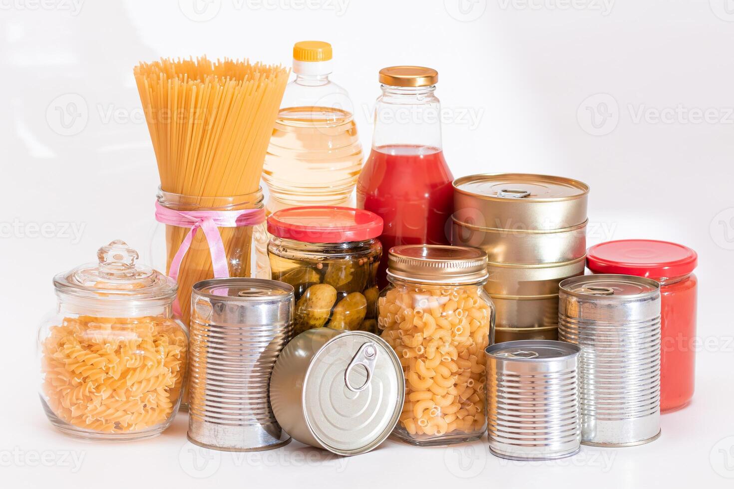 Food Reserves. Canned Food, Spaghetti, Pate, Tuna, Tomato Juice, Pasta, Fish and Grocery on White Background. Emergency Food Storage in Case of Crisis. Strategic Food Supplies photo