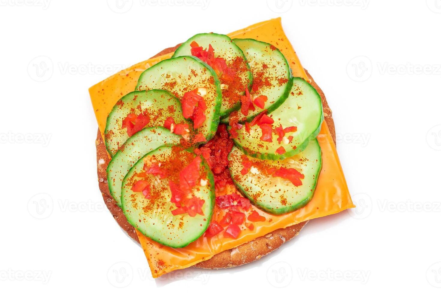 Crispy Cracker Sandwich with Fresh Cucumber, Cheese and Paprika - Isolated on White. Easy Breakfast. Quick and Healthy Sandwiches. Crispbread with Tasty Filling. Healthy Dietary Snack - Isolation photo