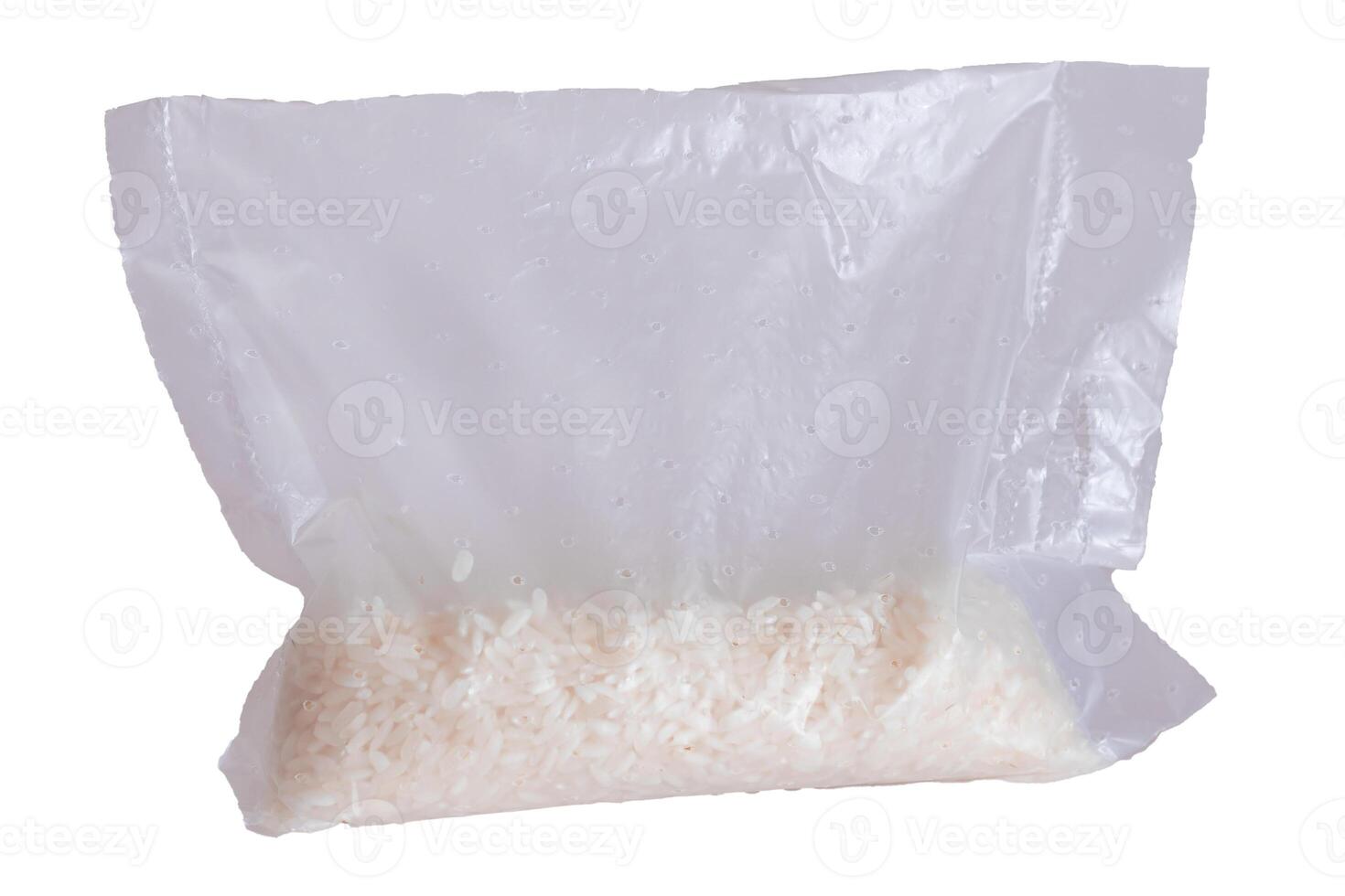 A Plastic Bag of White Long Grain Rice - Isolated on White Background. Small Transparent Package with Dry Rice - Isolation photo