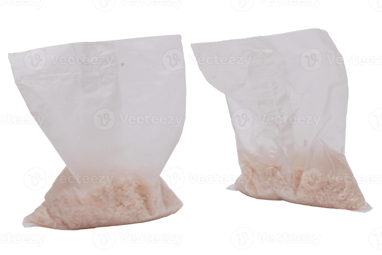 A Plastic Bags of White Long Grain Rice - Isolated on White Background. Small Transparent Packages with Dry Rice - Isolation photo