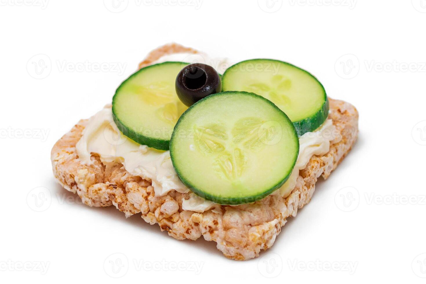 Rice Cake Sandwich with Fresh Cucumber, Cream Cheese and Olives - Isolated on White. Easy Breakfast. Quick and Healthy Sandwiches. Crispbread with Tasty Filling. Healthy Dietary Snack - Isolation photo