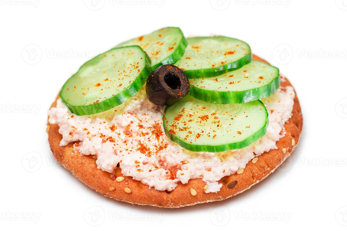 Crispy Cracker Sandwich with Fresh Cucumber, Fish Cream and Olives - Isolated on White. Easy Breakfast. Quick and Healthy Sandwiches. Crispbread with Tasty Filling. Healthy Dietary Snack - Isolation photo