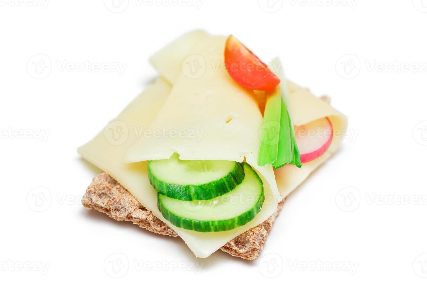 Whole Grain Crispbread with Cheese, Fresh Cucumber, Radish, Tomato and Green Onions - Isolated on White. Quick and Healthy Sandwiches. Crispbread with Tasty Filling. Healthy Dietary Snack - Isolation photo